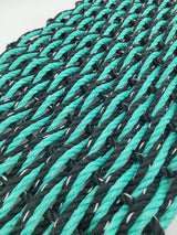 image shows a black and teal double weave rope mat