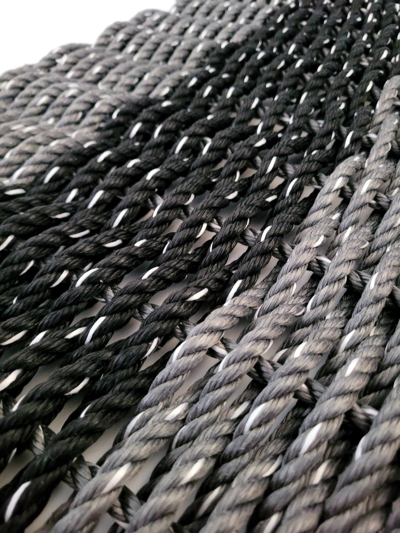 Gray and black lobster rope mat