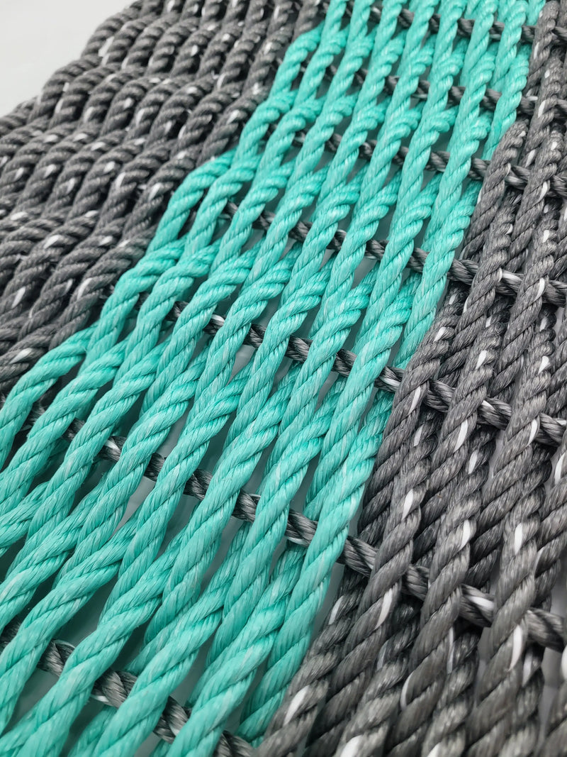 gray and teal lobster rope mat