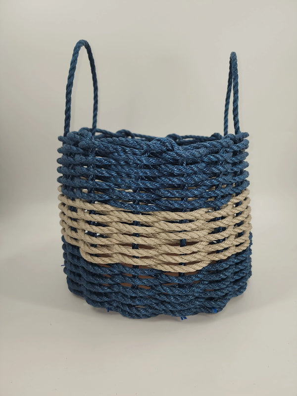 pictured is a navy blue lobster rope basket with a tan stripe in the middle
