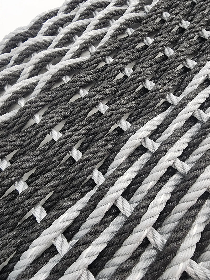 Image shows a black and gray double weave rope mat, black stripe in the middle