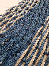 Image shows a Navy Blue and Tan rope mat, navy blue stripe in the middle