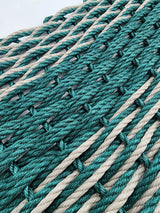 Image shows a Hunter Green and Tan double weave lobster rope mat. Hunter green stripe in the middle