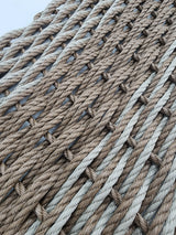 image shows a brown and tan double weave lobster rope mat, brown stripe in the middle