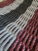 Photo shows a 5 Stripe rope welcome mat in the color pattern Burgundy, Light Gray, Black, Light Gray, Burgundy